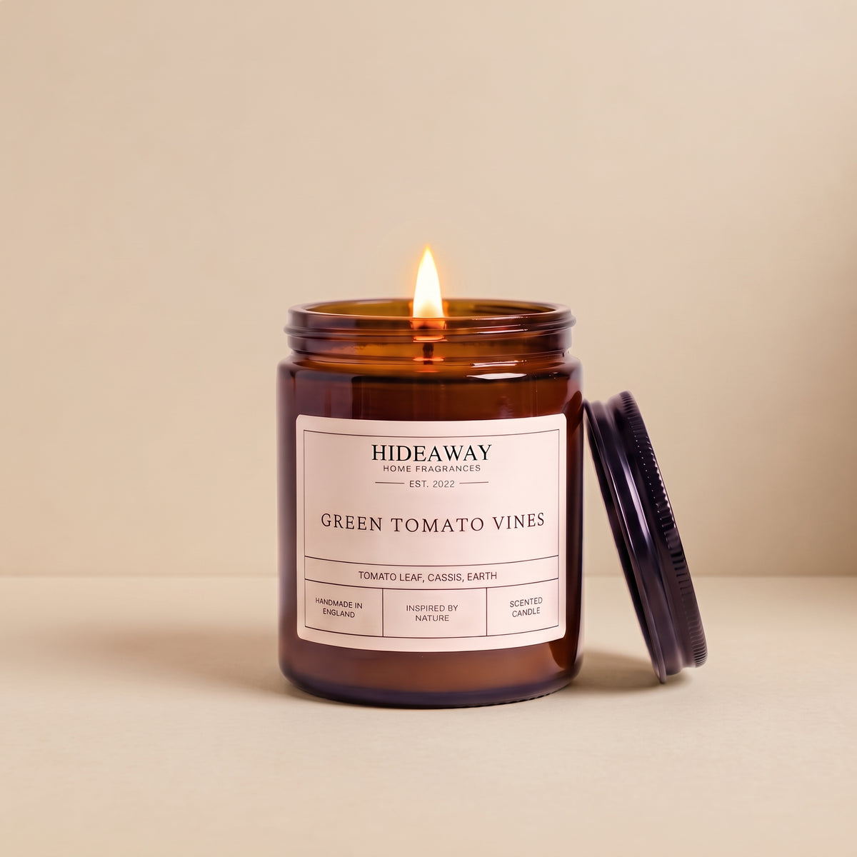 Hand-poured green tomato vines amber glass candle featuring crisp notes of crushed tomato leaves and herbal greens, Hideaway Home Fragrances