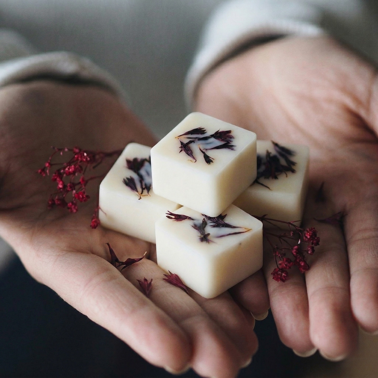 Sophisticated Oud and Bergamot botanical wax melting in a modern ceramic warmer - Hideaway Home Fragrances
