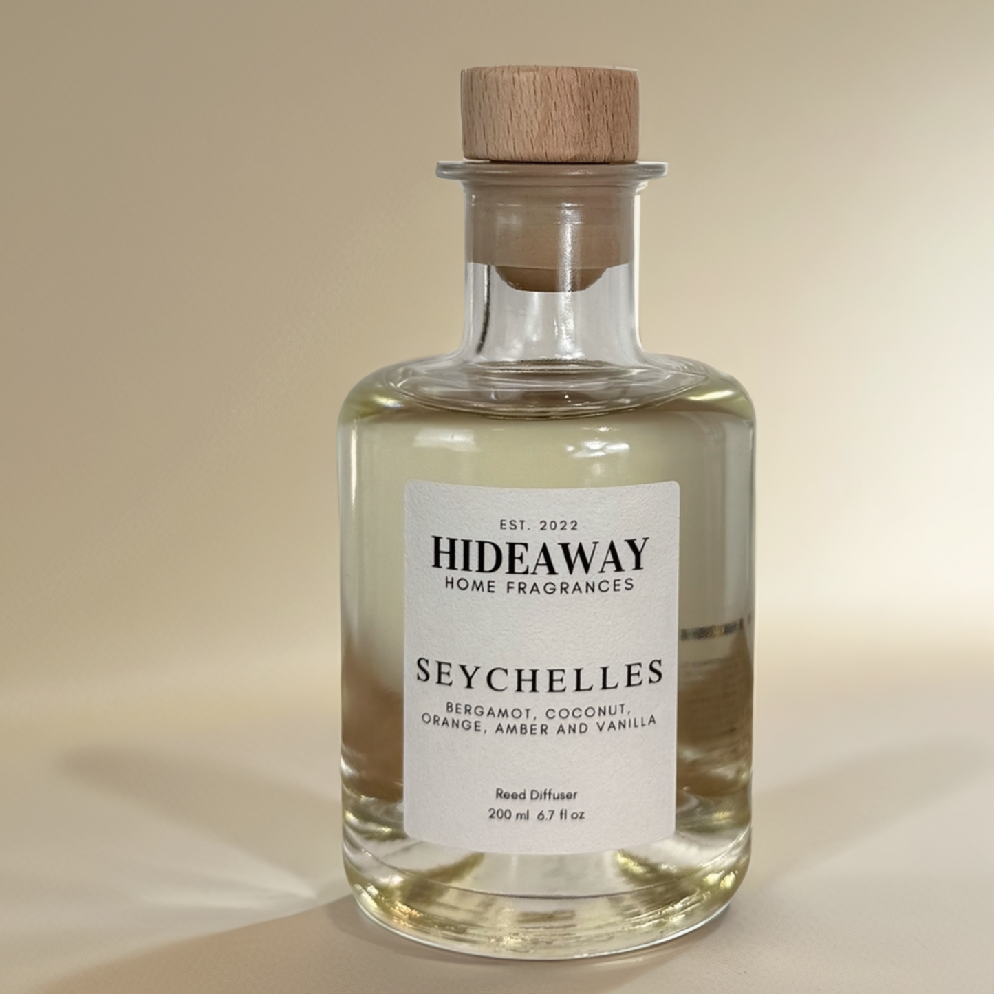 Soothing home fragrance featuring warm amber, creamy coconut, and rich vanilla - Hideaway Home Fragrances