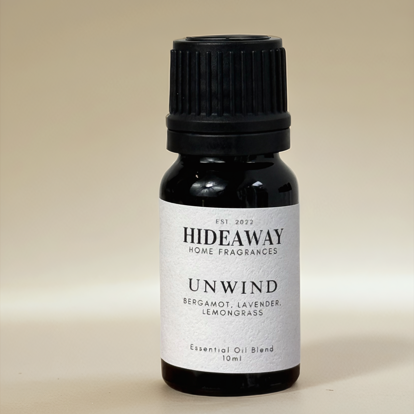 Unwind Essential Oil with refreshing lemongrass, calming bergamot, and soothing lavender for a revitalising and uplifting atmosphere — Hideaway Home Fragrances