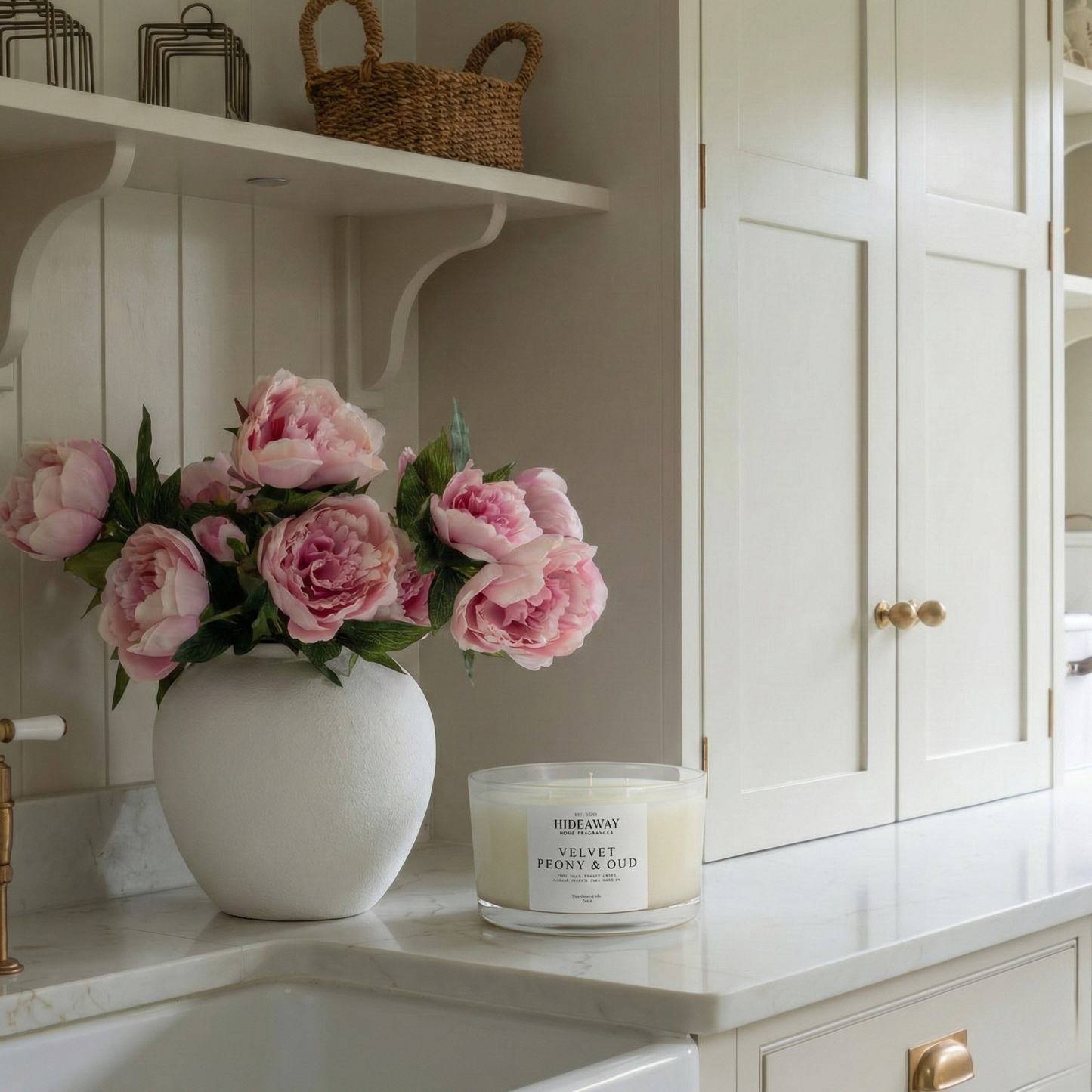 Opulent Velvet Peony & Oud three-wick candle filling a bedroom with warm floral and oud fragrance for an indulgent evening mood
