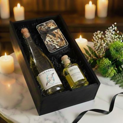 Choice of Sea Change Prosecco, Rosé, or Alcohol-Free bottles displayed next to a luxury reed diffuser.