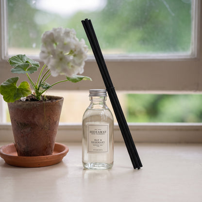 Bay and rosemary diffuser refill liquid by Hideaway Home Fragrances with notes of bay leaf, pine, lavender, and musk