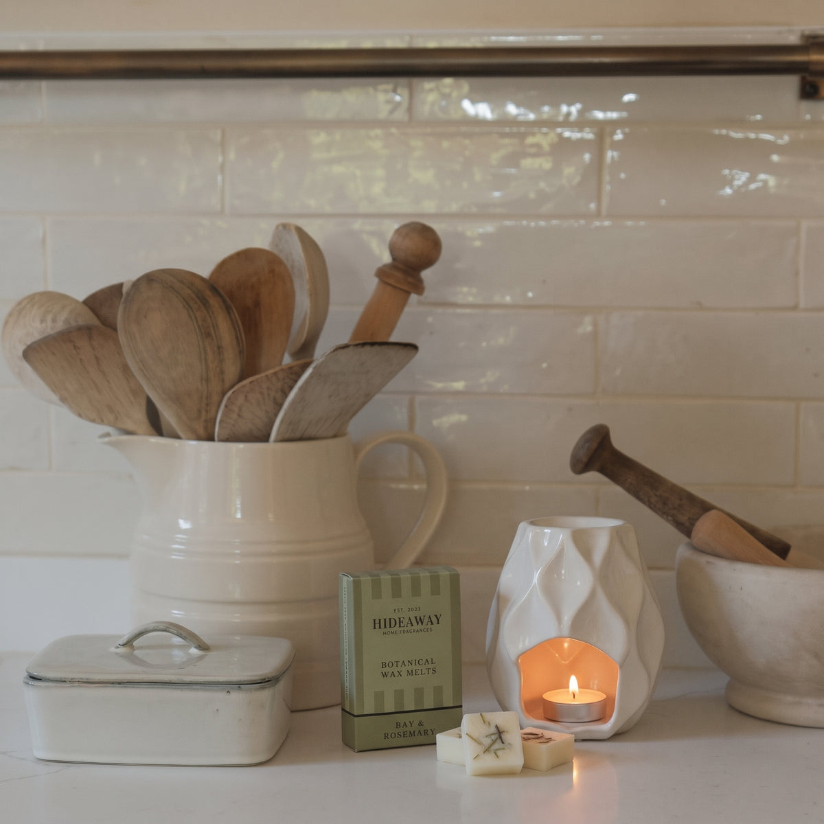 Handcrafted botanical wax melts by Hideaway Home Fragrances featuring dried rosemary and herbal bay leaf accents