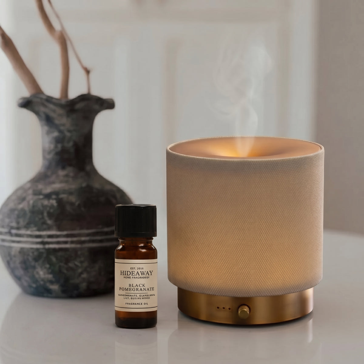 Scent notes breakdown for Hideaway Home Fragrances fragrance oil featuring ripe pomegranate, Casablanca lily, and smoky guaiac wood.