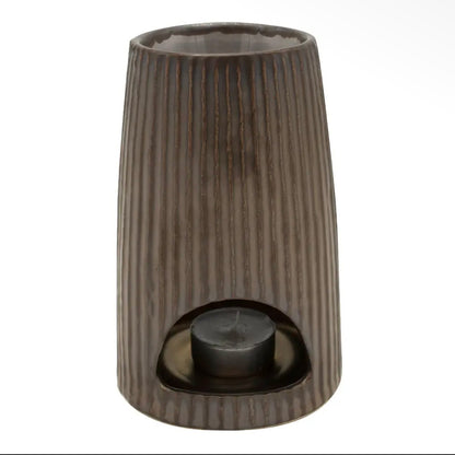 Detailed close-up of the textured, glossy bronze glaze and horizontal ribbed patterns on the ceramic wax melt burner by Hideaway Home Fragrances.