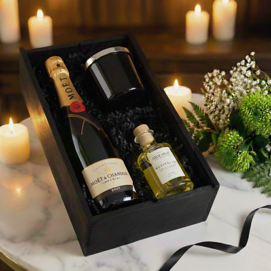 Amber & Oak Gift Box featuring Moët & Chandon Champagne, Hideaway glass candle, and reed diffuser inside a black wooden case.