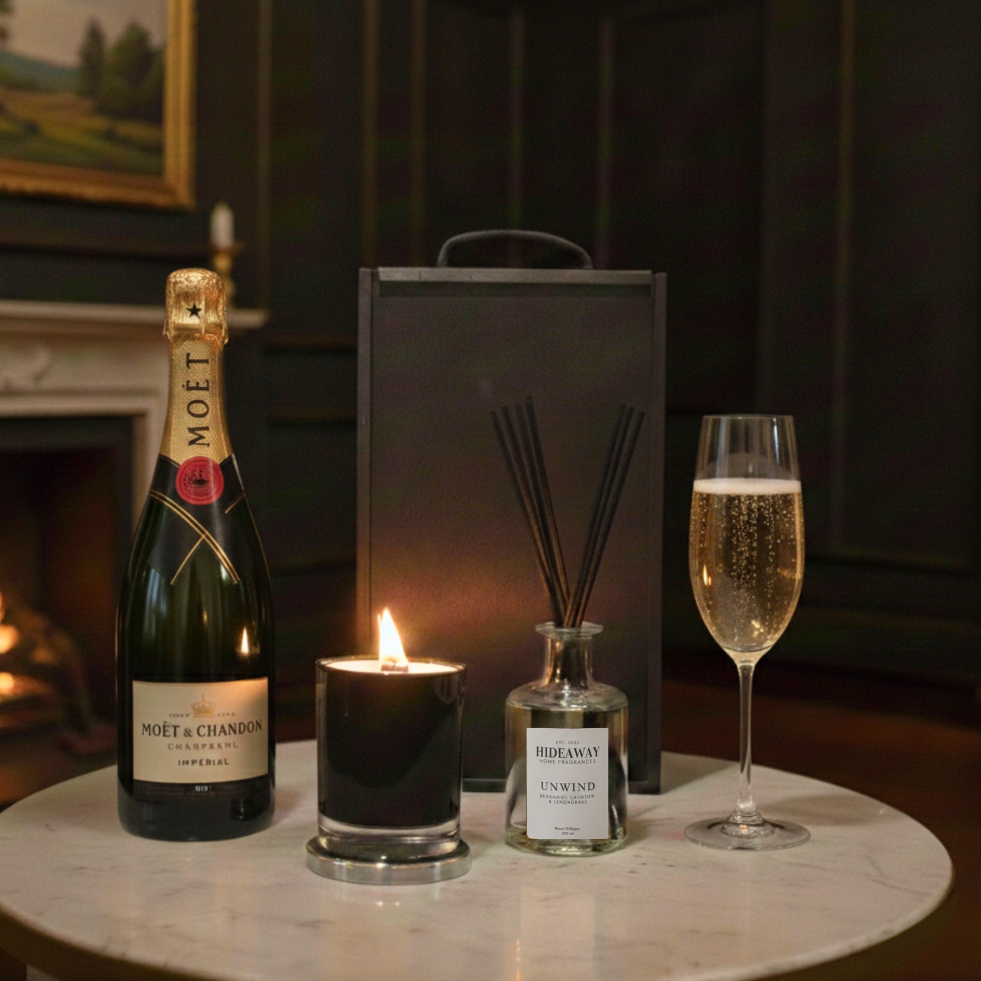 Amber & Oak Gift Box featuring Moët & Chandon Champagne, Hideaway glass candle, and reed diffuser inside a black wooden case.