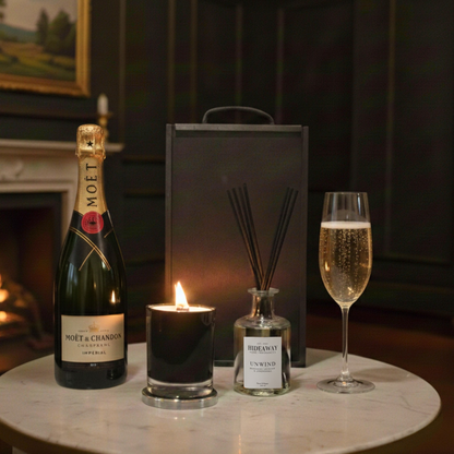 Amber & Oak Gift Box featuring Moët & Chandon Champagne, Hideaway glass candle, and reed diffuser inside a black wooden case.