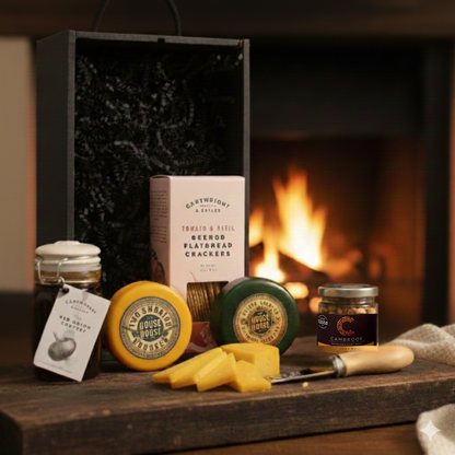 The Grazing Reserve Gift Box featuring Mouse House Cheese, Cartwright & Butler snacks, and Cambrooks nuts in a black wooden case.