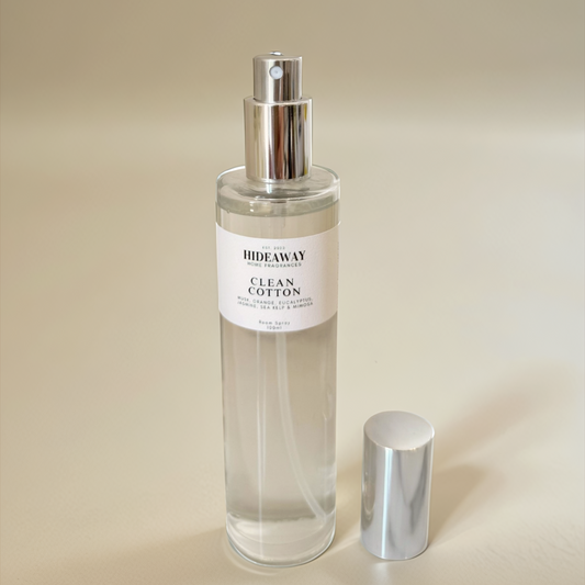 Uplifting home fragrance mist in a sleek bottle, perfect for creating a calm, airy space with a clean cotton aroma - Hideaway Home Fragrances