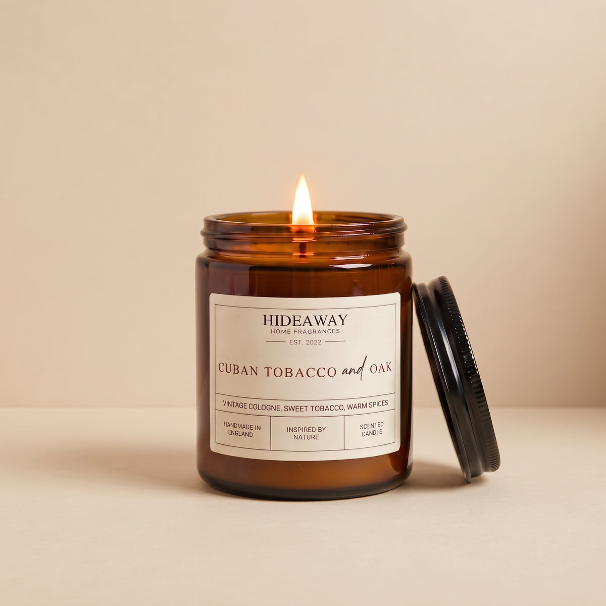 Hand-poured Cuban tobacco and oak aromatic amber glass candle featuring rich notes of sweet tobacco and warm oak, Hideaway Home Fragrances