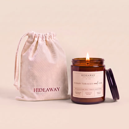 Cuban tobacco and oak amber glass candle with wooden lid by Hideaway Home Fragrances