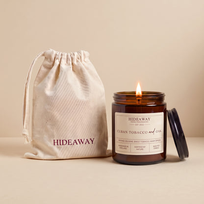 Cuban tobacco and oak amber glass candle with wooden lid by Hideaway Home Fragrances