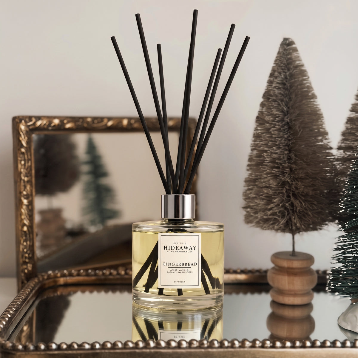Hideaway Home Fragrances gingerbread reed diffuser bottle with natural fibre
 reeds on a shelf