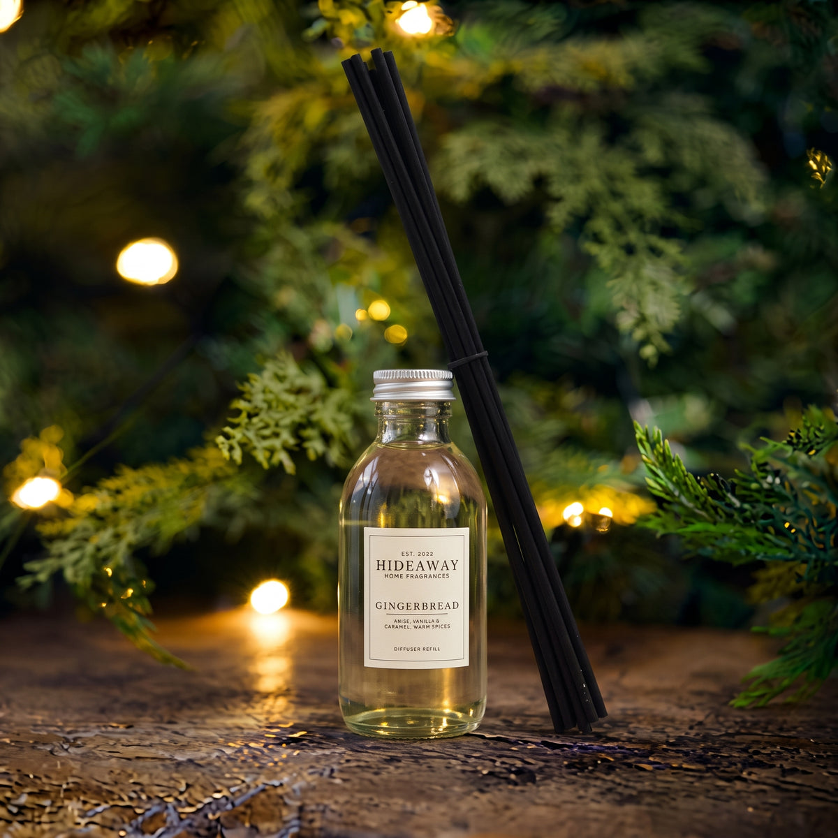 Hideaway Home Fragrances gingerbread reed diffuser refill liquid bottle showing fragrance notes on label