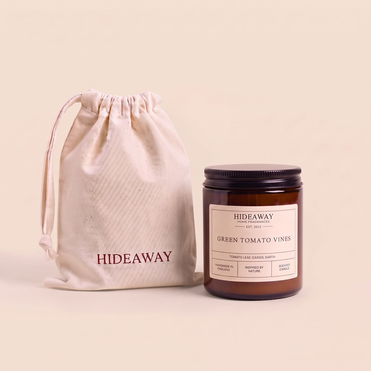 Earthy green tomato vines aromatic candle in an amber glass jar creating a fresh garden mood from Hideaway Home Fragrances
