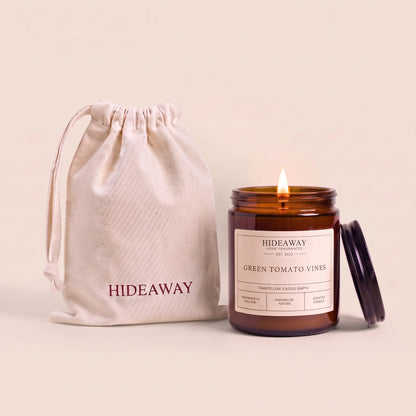 Green tomato vines amber glass candle with fresh botanical scent by Hideaway Home Fragrances