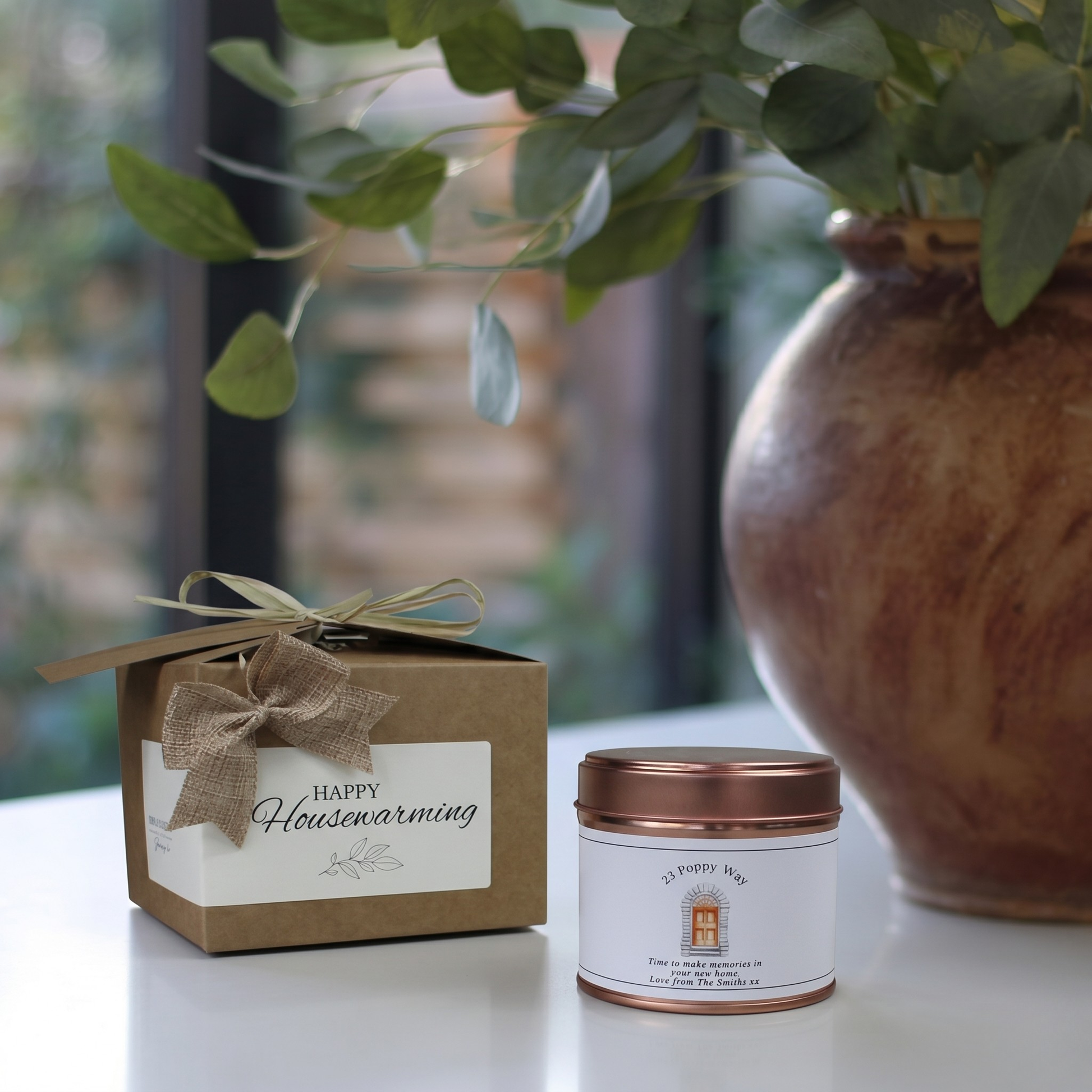 Custom housewarming care package gift box featuring a personalized new home milestone candle and matching home fragrance diffuser by Hideaway Home Fragrances.