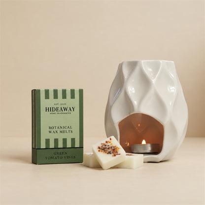Hideaway Home Fragrances green tomato vines botanical wax melts packaging detailing notes of fresh tomato vine, rosy floral heart, and cassis