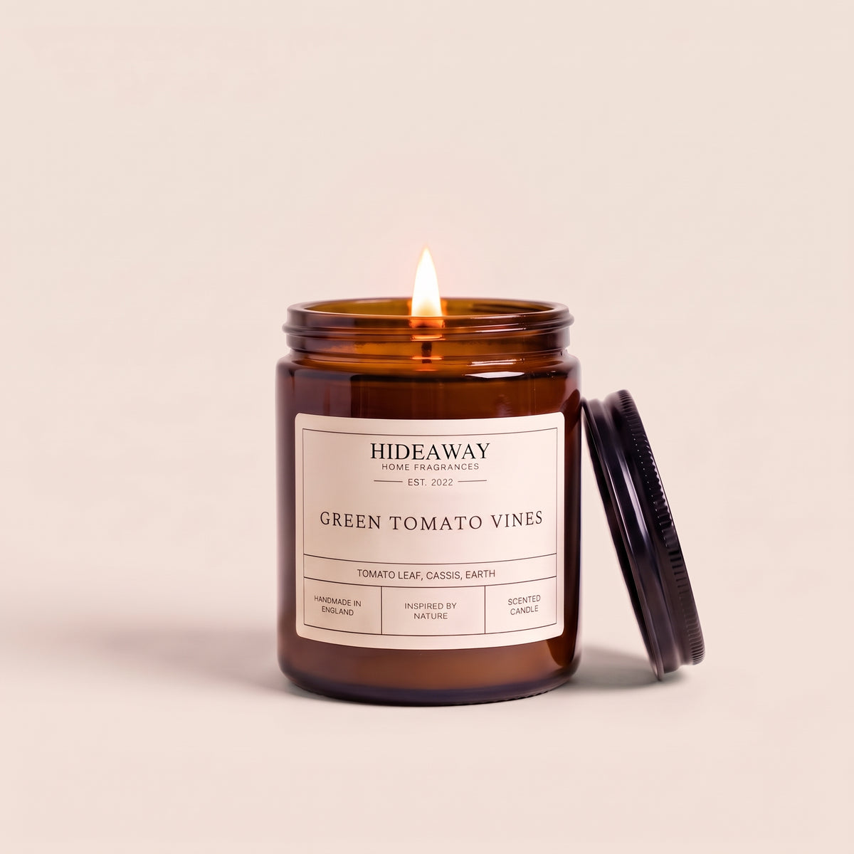 Hand-poured green tomato vines amber glass candle featuring crisp notes of crushed tomato leaves and herbal greens, Hideaway Home Fragrances