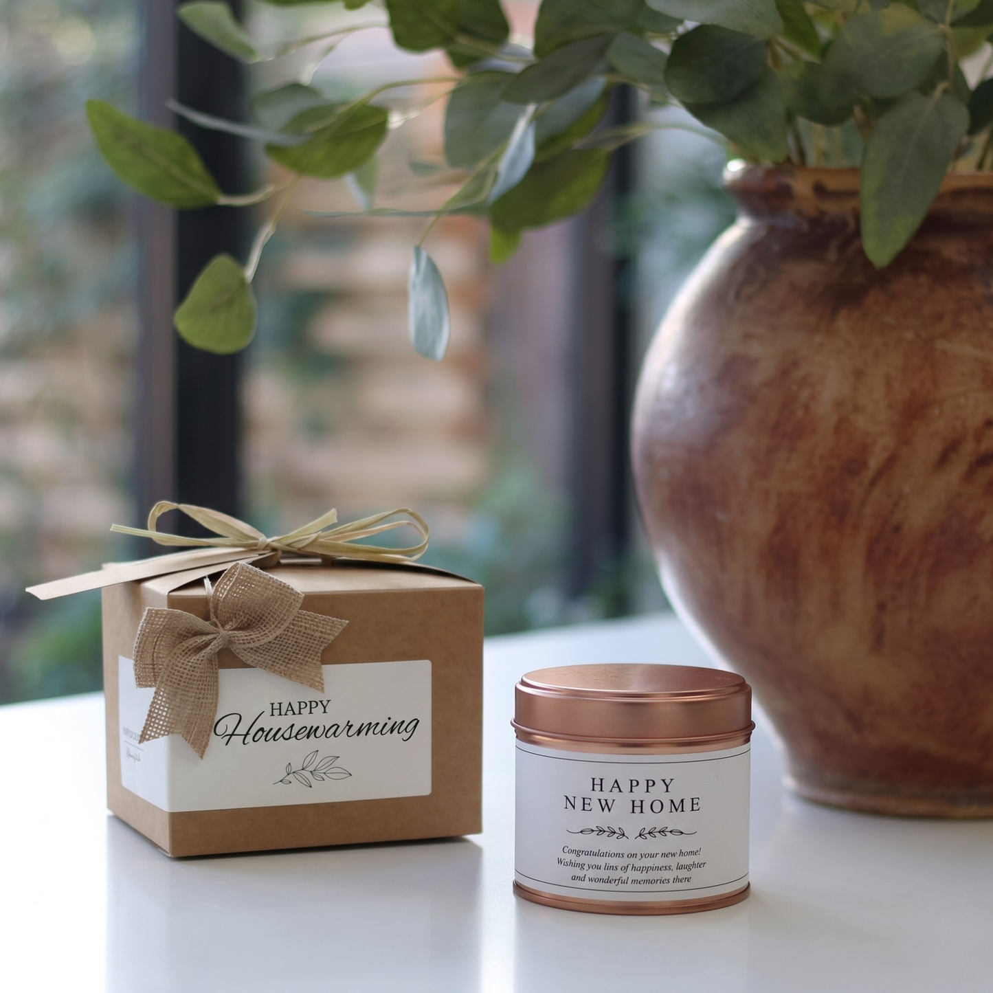 Custom housewarming gift box featuring a personalized new homeowner congratulations candle and matching home fragrance diffuser by Hideaway Home Fragrances.