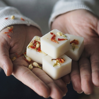 Luxurious Heritage Noir botanical wax melting in a modern ceramic warmer - Hideaway Home Fragrances