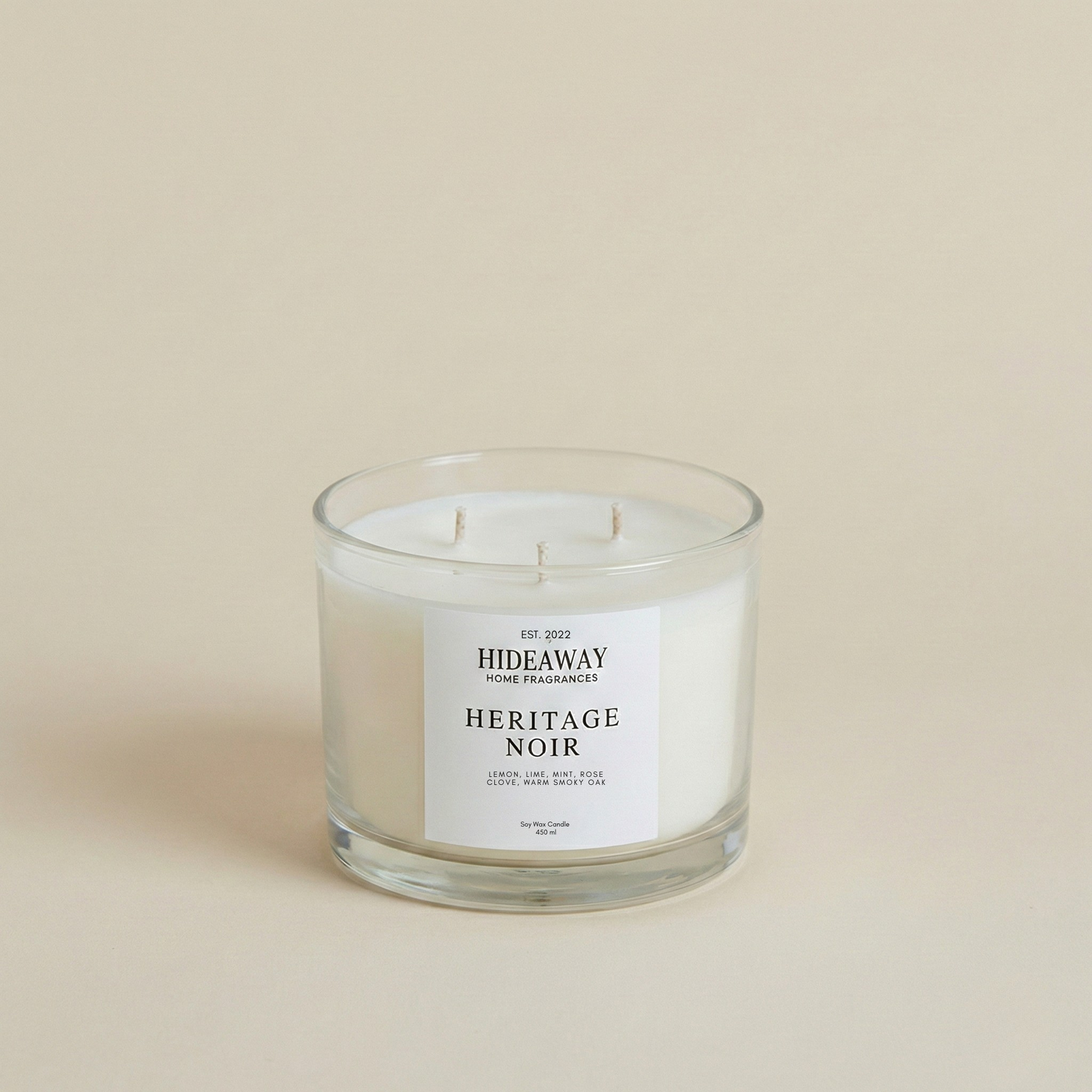 Luxury Heritage Noir soy candle with a rich, sophisticated aroma of spicy clove, earthy vetiver, and warm musk for an atmospheric home fragrance