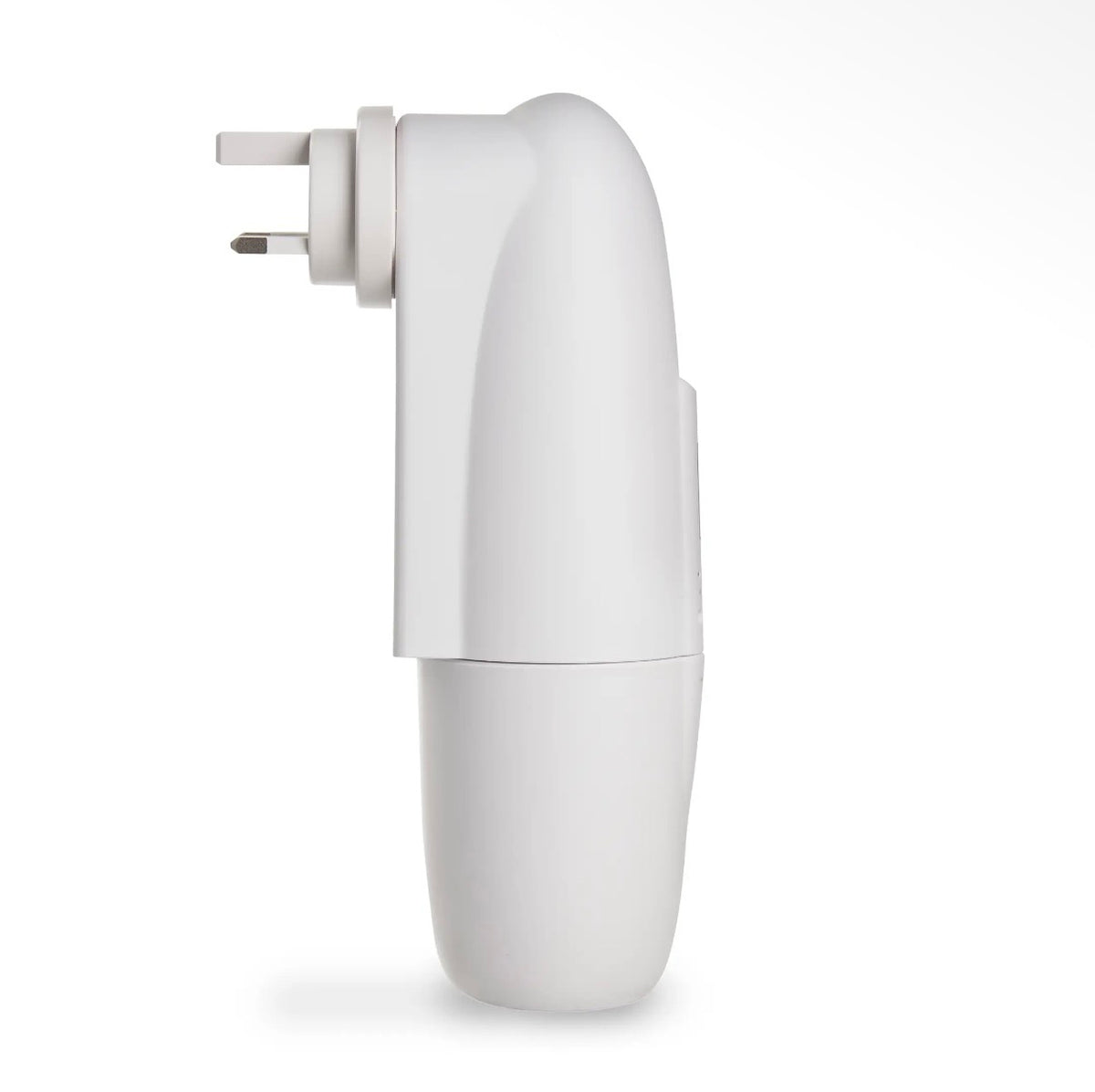 A hand plugging the compact Kapplico Waterless Plug-In Diffuser by Hideaway Home Fragrances into a bedroom outlet, showcasing its small, space-saving size.