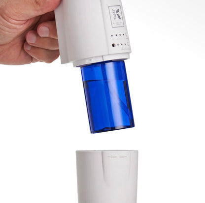 Close-up of the Kapplico Waterless Plug-In Diffuser by Hideaway Home Fragrances, showcasing its textured casing, subtle branding, and compact dial controls.