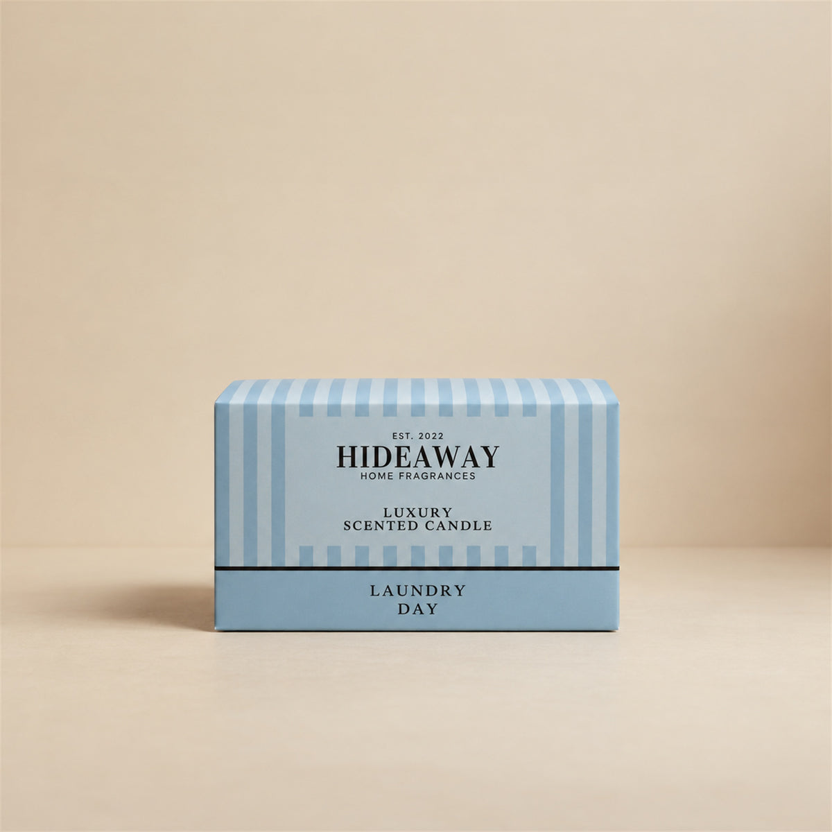 Luxury Hideaway Home Fragrances Laundry Day 3 wick candle featuring notes of green apple, rose, patchouli, and warm vanilla