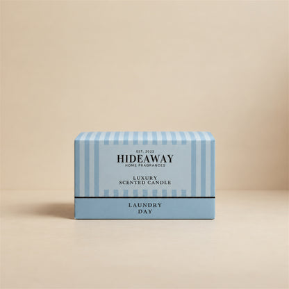Luxury Hideaway Home Fragrances Laundry Day 3 wick candle featuring notes of green apple, rose, patchouli, and warm vanilla