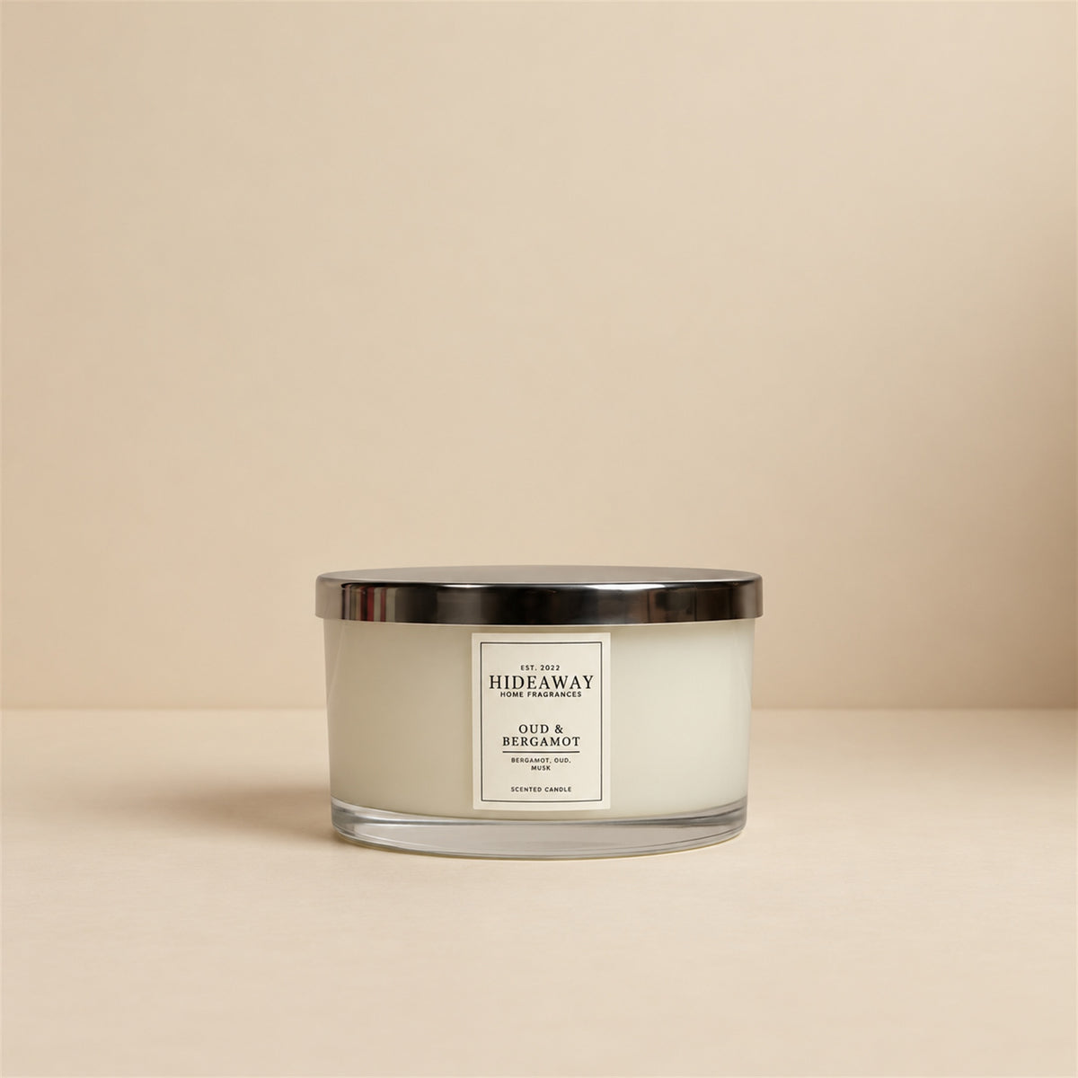 Hideaway Home Fragrances Oud and Bergamot 3 wick scented candle featuring deep woody cedarwood, amber, and precious woods