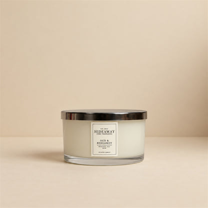 Hideaway Home Fragrances Oud and Bergamot 3 wick scented candle featuring deep woody cedarwood, amber, and precious woods