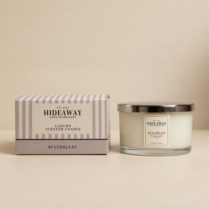 Hideaway Home Fragrances Seychelles 3 wick candle in glass jar with warm tropical coconut scent
