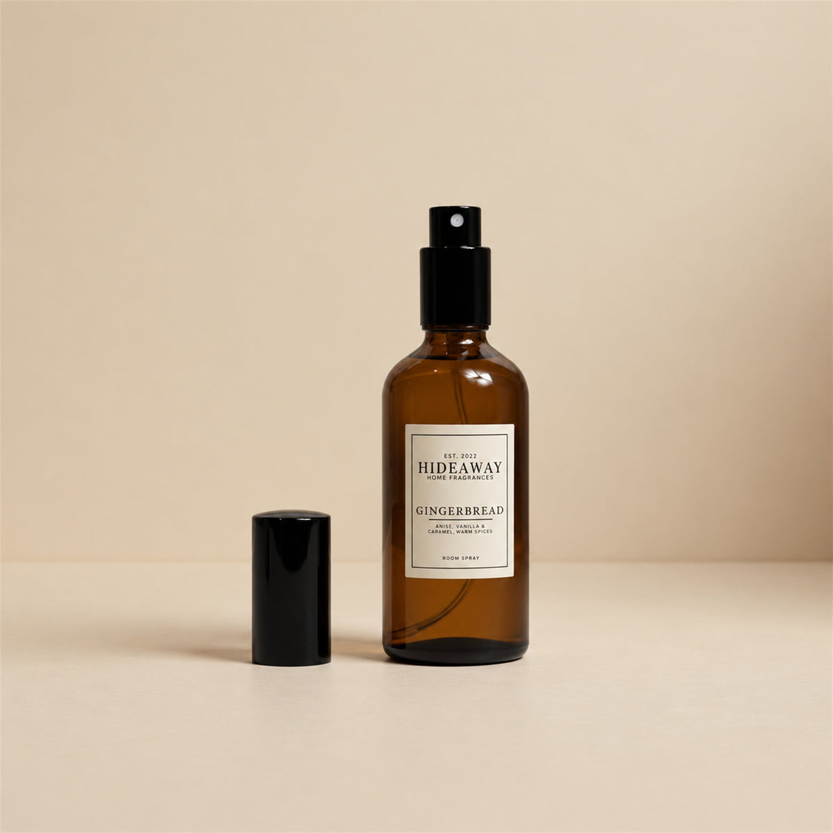 Hand misting Hideaway Home Fragrances gingerbread room spray into the air to diffuse aromas of homemade gingerbread and sweet maple syrup.