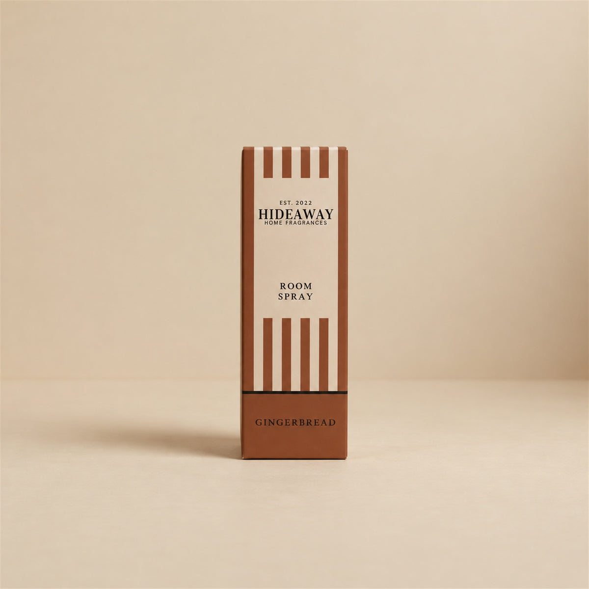 Boxed gift packaging for Hideaway Home Fragrances gingerbread room spray featuring sweet caramel and crisp cookie home fragrance notes.