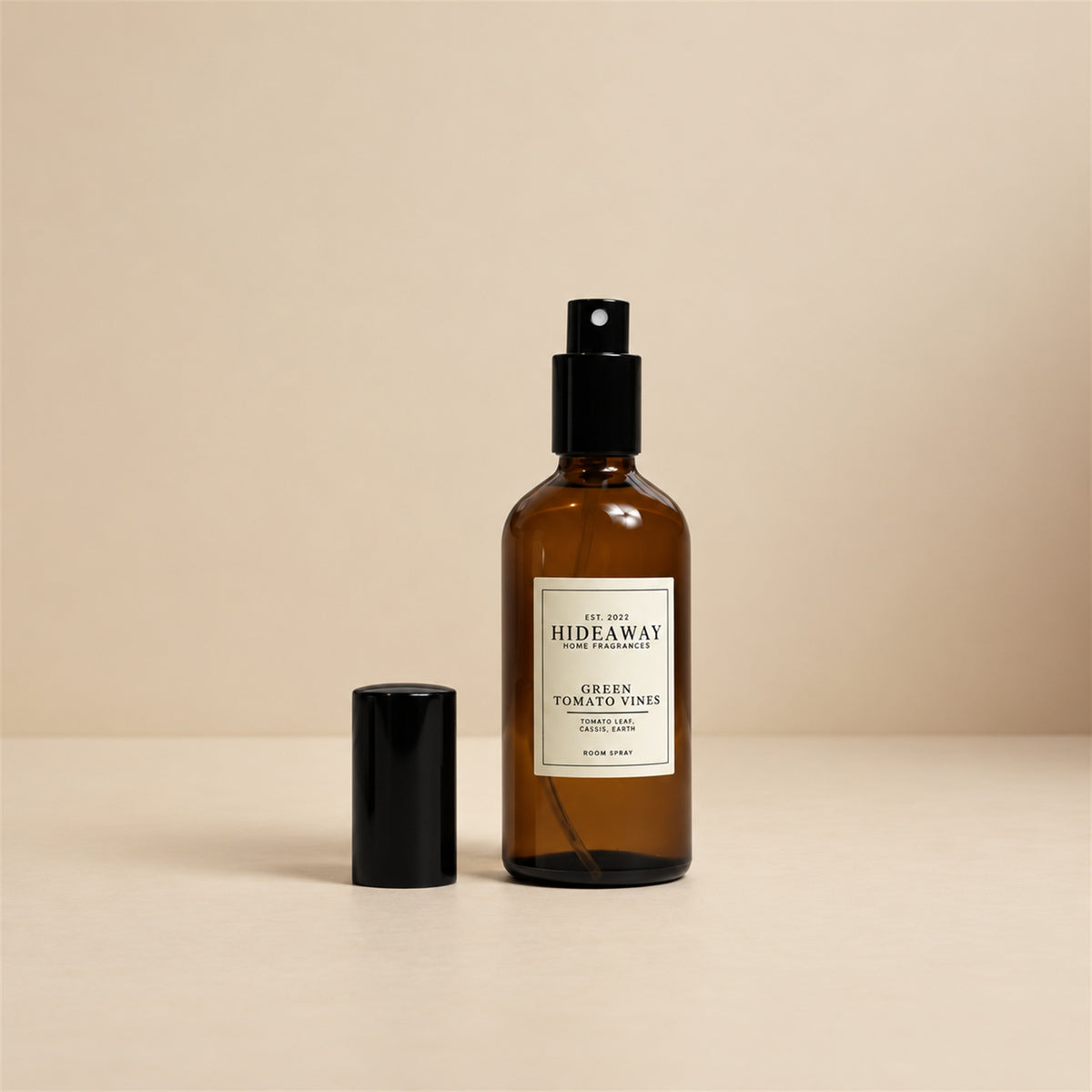 Fine mist released from the Hideaway Home Fragrances green tomato vines room spray bottle to diffuse fresh tagette and rose-tinted botanical aromas.