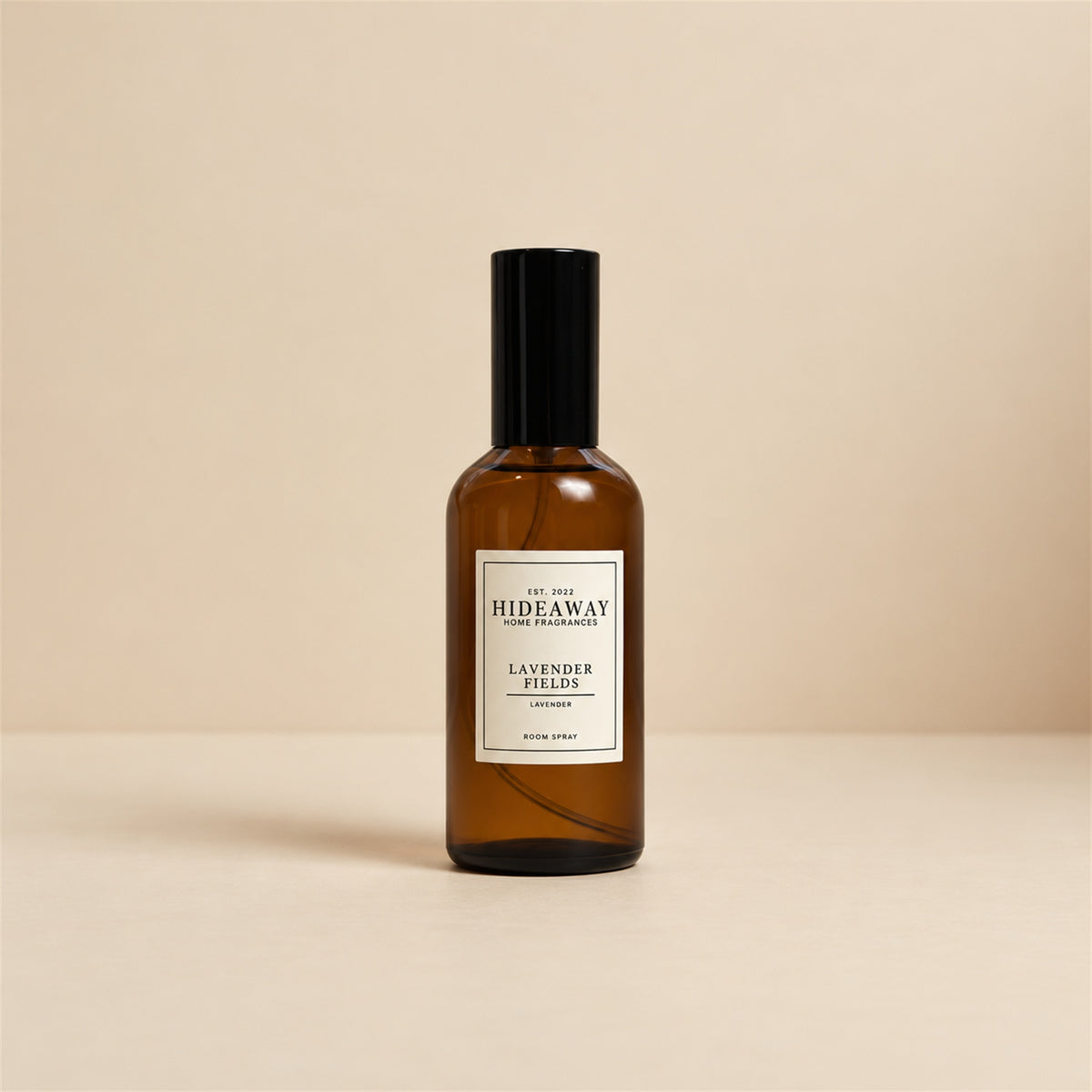 Hideaway Home Fragrances lavender fields room spray placed on a bedside table alongside fresh dried lavender sprigs for sleep wellness.