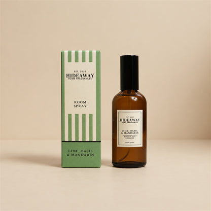 Hideaway Home Fragrances lime basil and mandarin room spray bottle centred on a neutral studio background.