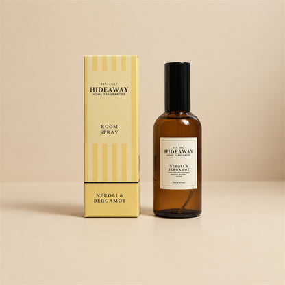 Hideaway Home Fragrances neroli and bergamot room spray bottle standing against a bright, neutral studio background.