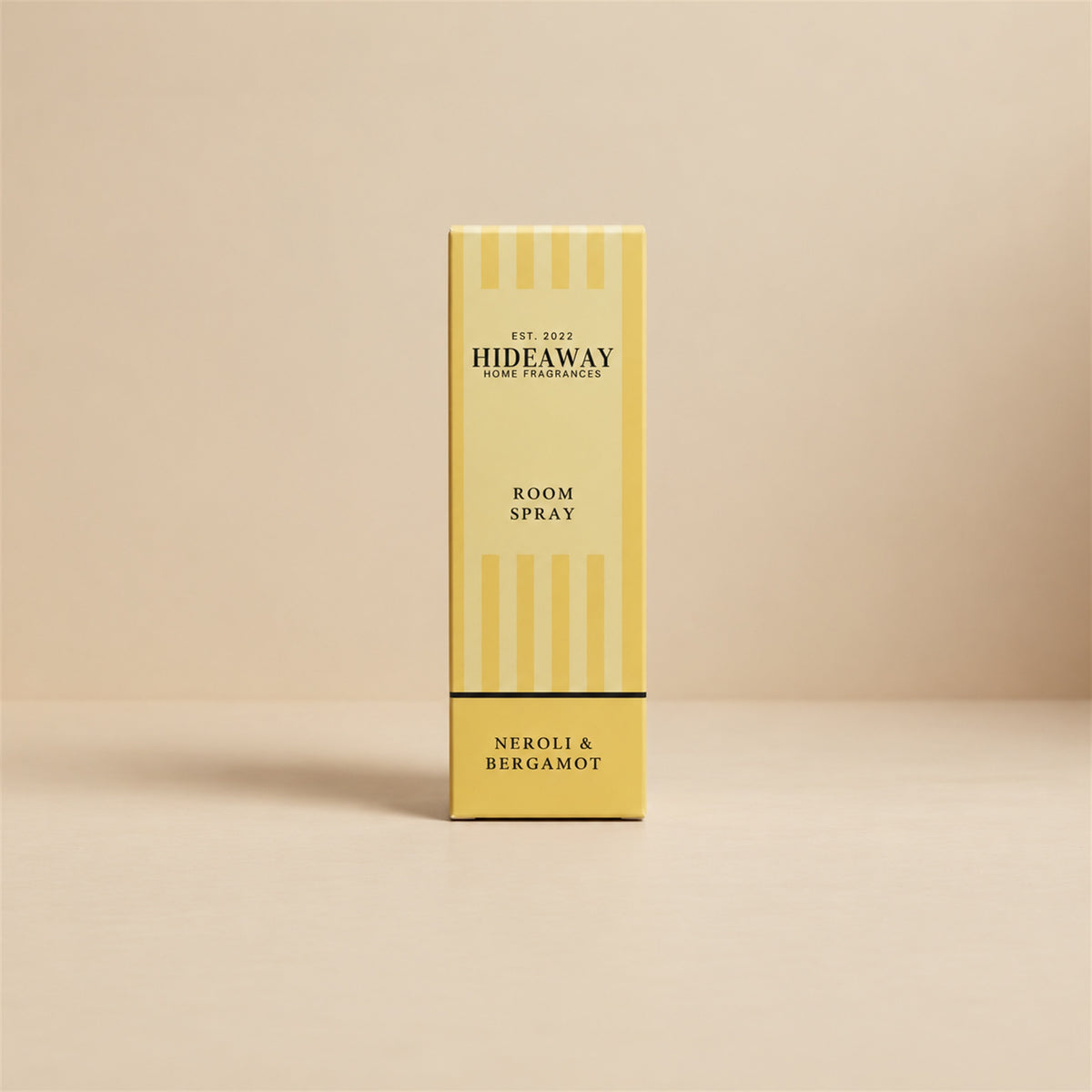 Luxury retail gift packaging and glass bottle for Hideaway Home Fragrances neroli and bergamot room spray featuring herbal and floral aromas.