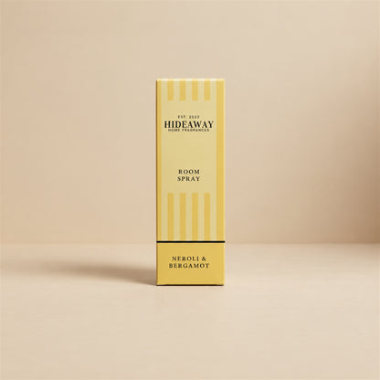 Luxury retail gift packaging and glass bottle for Hideaway Home Fragrances neroli and bergamot room spray featuring herbal and floral aromas.