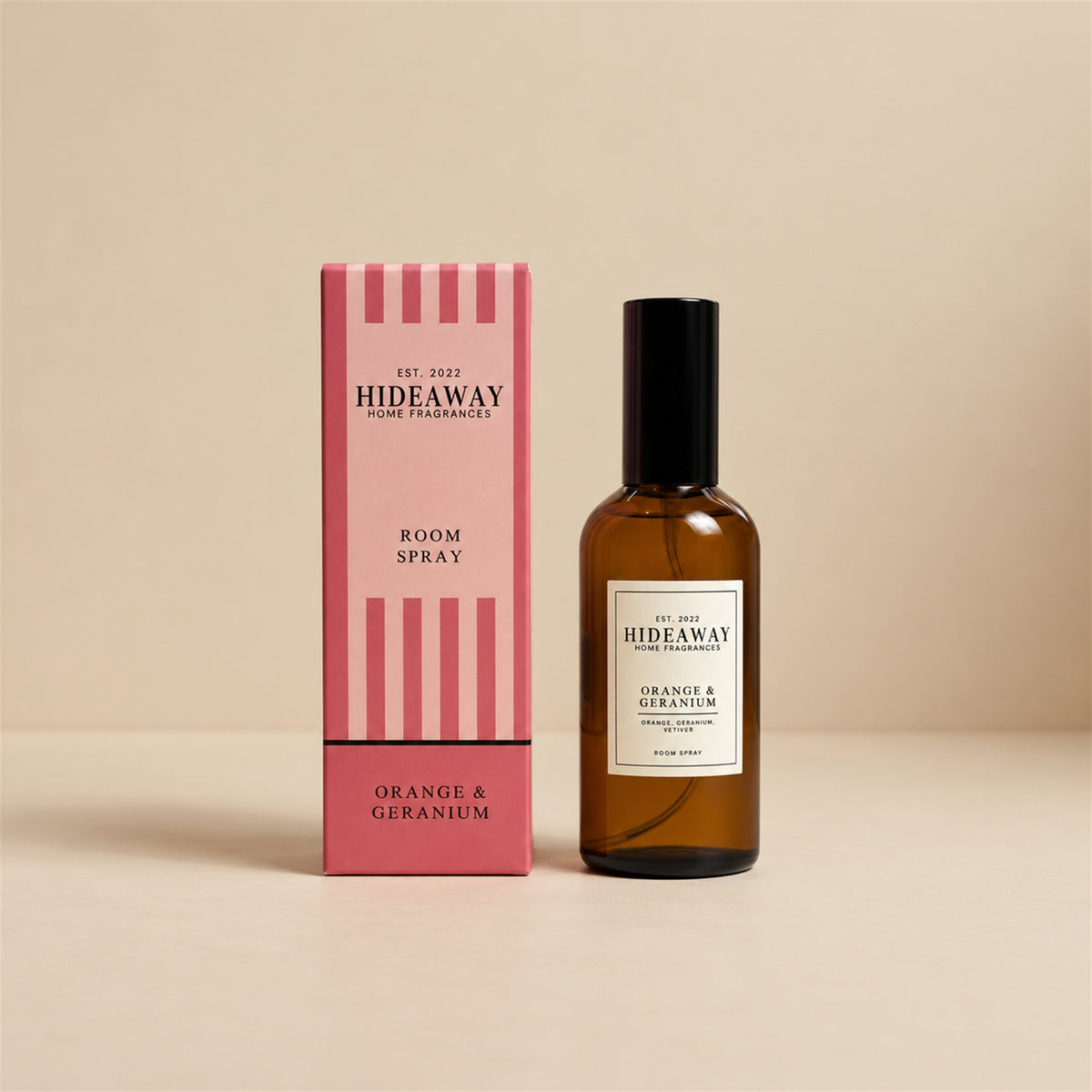 Hideaway Home Fragrances orange and geranium room spray bottle centred on a bright, minimalist studio backdrop.
