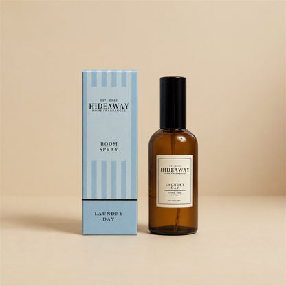 Hideaway Home Fragrances laundry day room spray bottle displayed on a crisp white studio background.