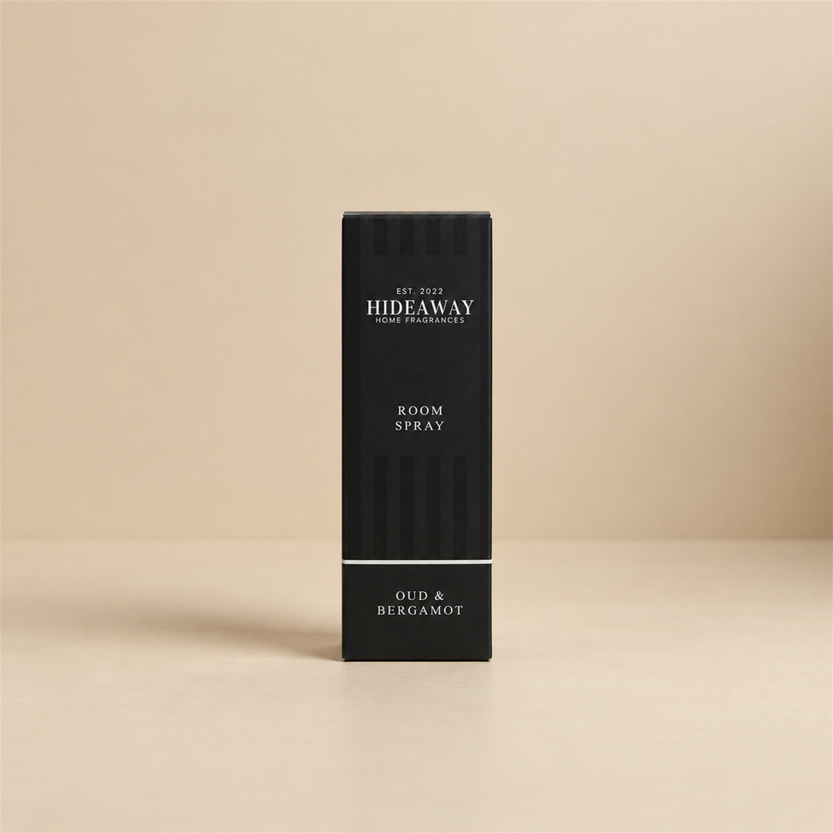 Luxury packaged gift box and matching bottle for Hideaway Home Fragrances oud and bergamot room spray showcasing woody, oriental home fragrance notes.