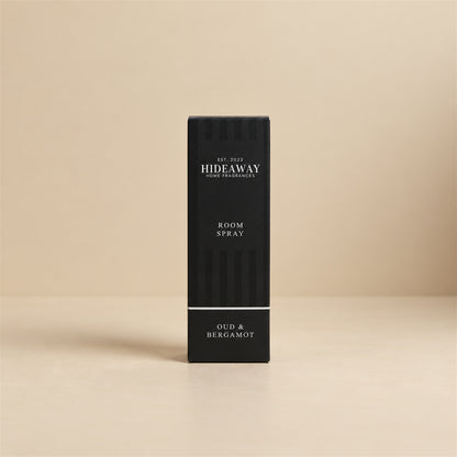 Luxury packaged gift box and matching bottle for Hideaway Home Fragrances oud and bergamot room spray showcasing woody, oriental home fragrance notes.