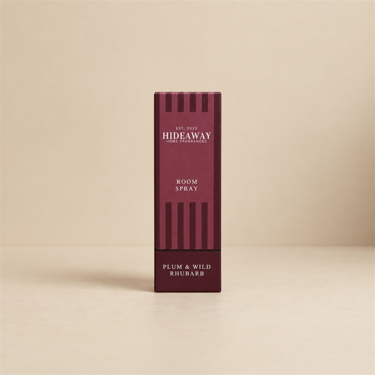 Luxury packaged gift box and matching bottle for Hideaway Home Fragrances plum and wild rhubarb room spray highlighting fruity home fragrance notes.