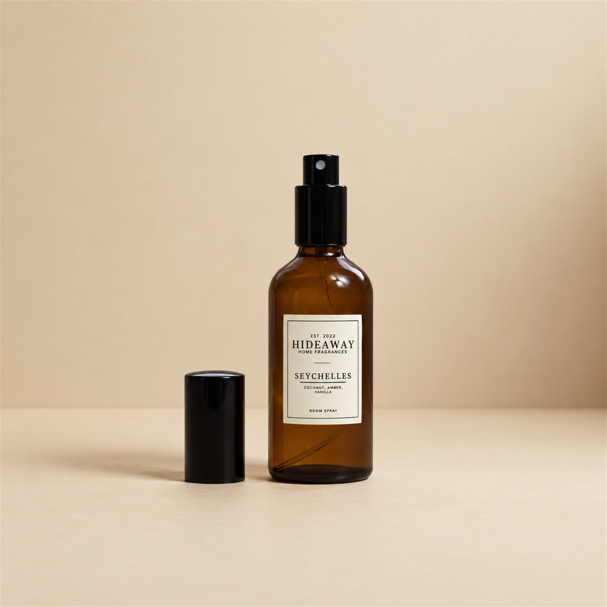Fine mist released from the Hideaway Home Fragrances seychelles room spray bottle to fill the room with sweet butter, coconut, and exotic floral notes.