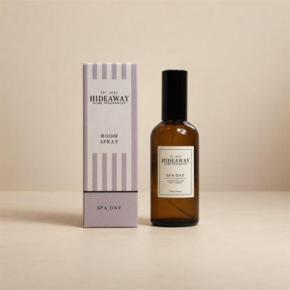 Hideaway Home Fragrances spa day room spray bottle centered against a crisp, neutral studio background.